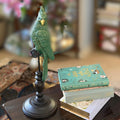 Cosmo Green Parrot on Perch The Wolf and Peacock
